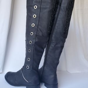 Black over the knee, faux leather boots.